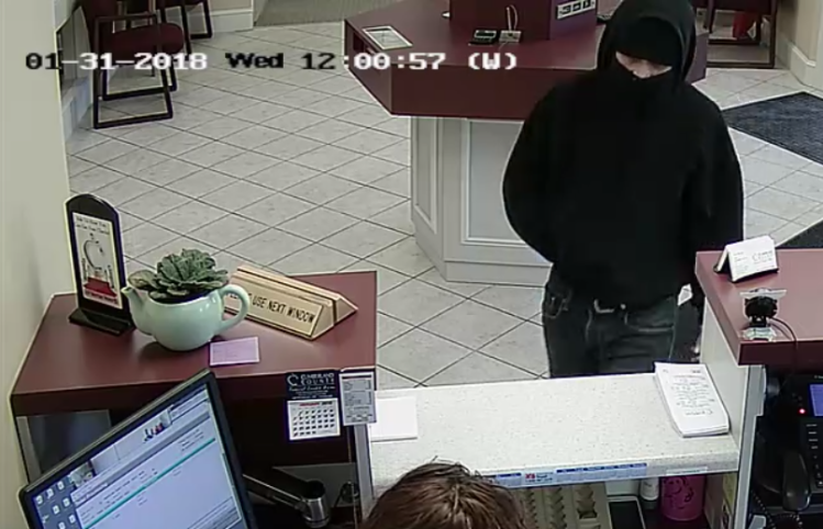 This image from a security camera shows the person who robbed a credit union in Falmouth on Wednesday. Police are asking for the public's health in identifying the person.