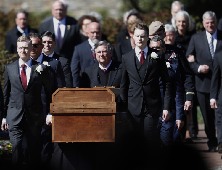 The casket of the Rev. Billy Graham is carried during his funeral service Friday. 
