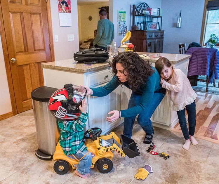 Amy Richard at home in Hebron with her children, Owen, left, and Olivia. Richard, 41, who is a nonsmoker, has been diagnosed with stage 4 lung cancer.