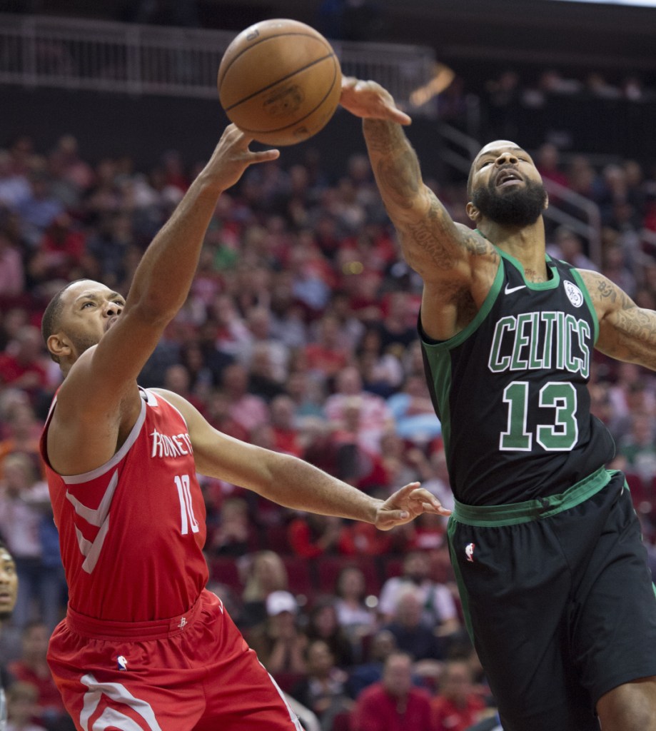 Celtics forward Marcus Morris blocks a shot by Houston's Eric Gordon during the Rockets' 123-120 win Saturday night in Houston.