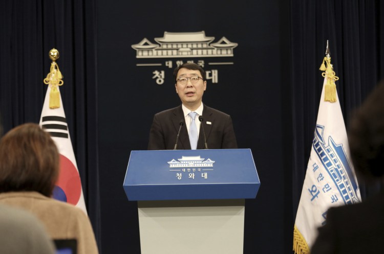 Yoon Young-chan, South Korean President Moon Jae-in's press secretary, speaks during a briefing in Seoul on Sunday. South Korea's presidential office says a 10-member government delegation will visit North Korea this week.
