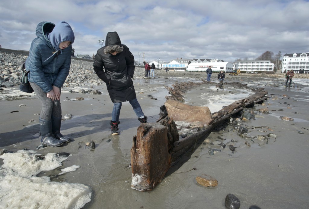 Rebecca Dugas, left, and Jayan Landry check out a shipwreck at Short Sands Beach in York on Monday. The shipwreck was uncovered over the past three days of coastal flooding. The last time it was revealed was in 2013.
YORK, ME - MARCH 5: Rebecca Dugas, left, and Jayan Landry check out a shipwreck at Short Sands Beach in York on Monday. The shipwreck was uncovered over the past three days of coastal flooding. The last time it was revealed was in 2013. (Staff Photo by Gregory Rec/Staff Photographer)
