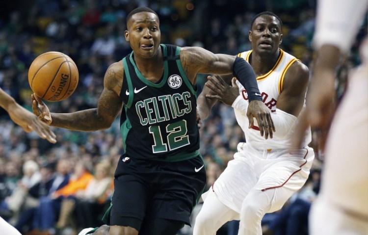 Boston's Terry Rozier drives past Indiana's Darren Collison during the first quarter of the Pacers' 99-97 win Sunday night in Boston.