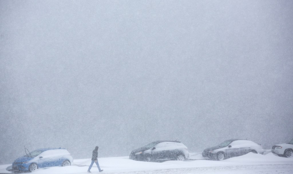 A pedestrian makes his way through wind-driven snow on Portland's Eastern Prom. Before this storm, the city had already gotten almost 2 feet more snow than usual this season.