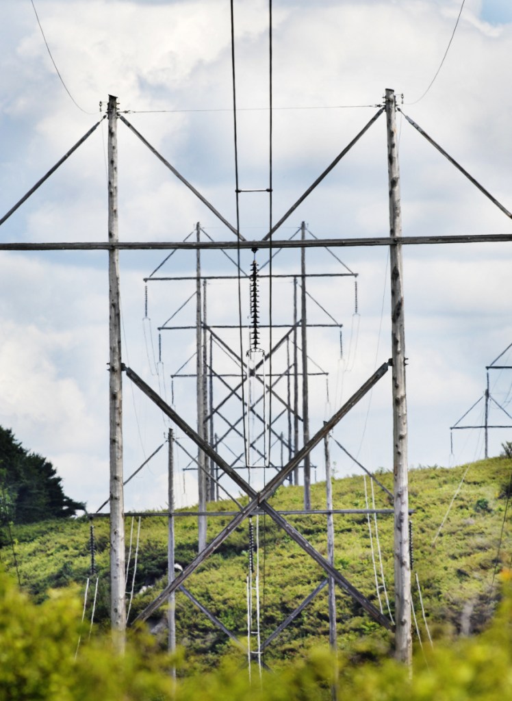 Central Maine Power's bid to build a 145-mile transmission line from the Canadian border that would supply renewable energy to Massachusetts received a major boost when the New Hampshire site panel ordered a delay that likely will eliminate CMP's competitor.