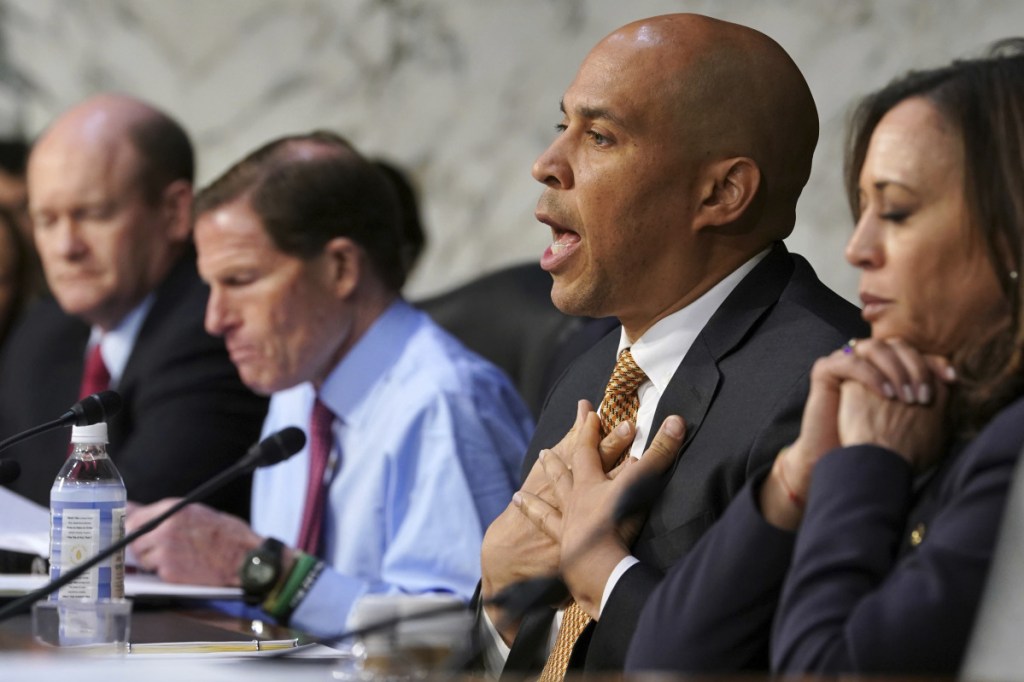Sen. Cory Booker, D-New Jersey, talks about gun violence, during a Senate Judiciary Committee hearing on the Parkland, Florida, school shootings and school safety, on Wednesday on Capitol Hill in Washington. At left are Sen. Chris Coons, D-Delaware, and Sen. Richard Blumenthal, D-Connecticut. At far right is Sen. Kamala Harris, D-California.