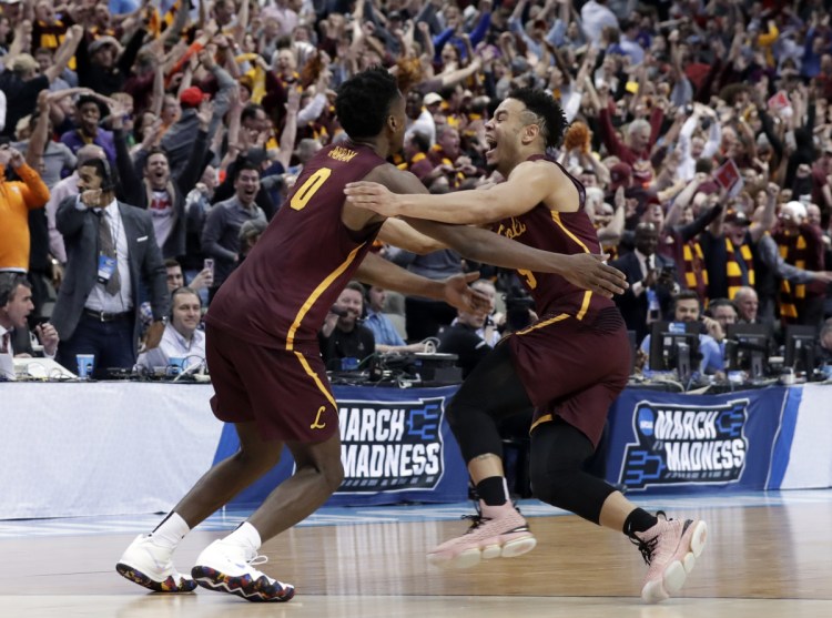 Loyola-Chicago guard Donte Ingram, left, and Marques Townes, celebrate their 64-62 win over Miami in a first-round game at the NCAA men's basketball tournament Thursday in Dallas.
