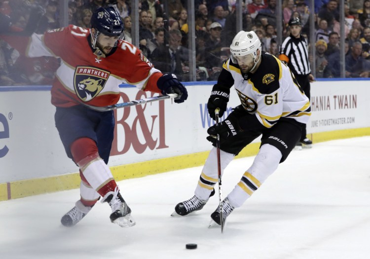 Florida's Vincent Trocheck and Boston's Rick Nash pursue the puck in the first period Thursday night in Sunrise, Fla.