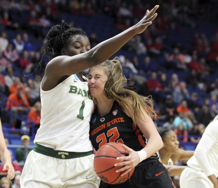 Kat Tudor of Oregon State collides with Dekeiya Cohen of Baylor while trying to drive Friday. Oregon State won, 72-67.