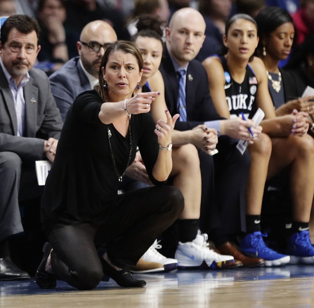 Duke Coach Joanne P. McCallie saw her team's season come to an end Saturday against top-ranked Connecticut, which moved a step closer to an 11th straight Final Four by defeating the Blue Devils 72-59 in a regional semifinal in Albany, N.Y.