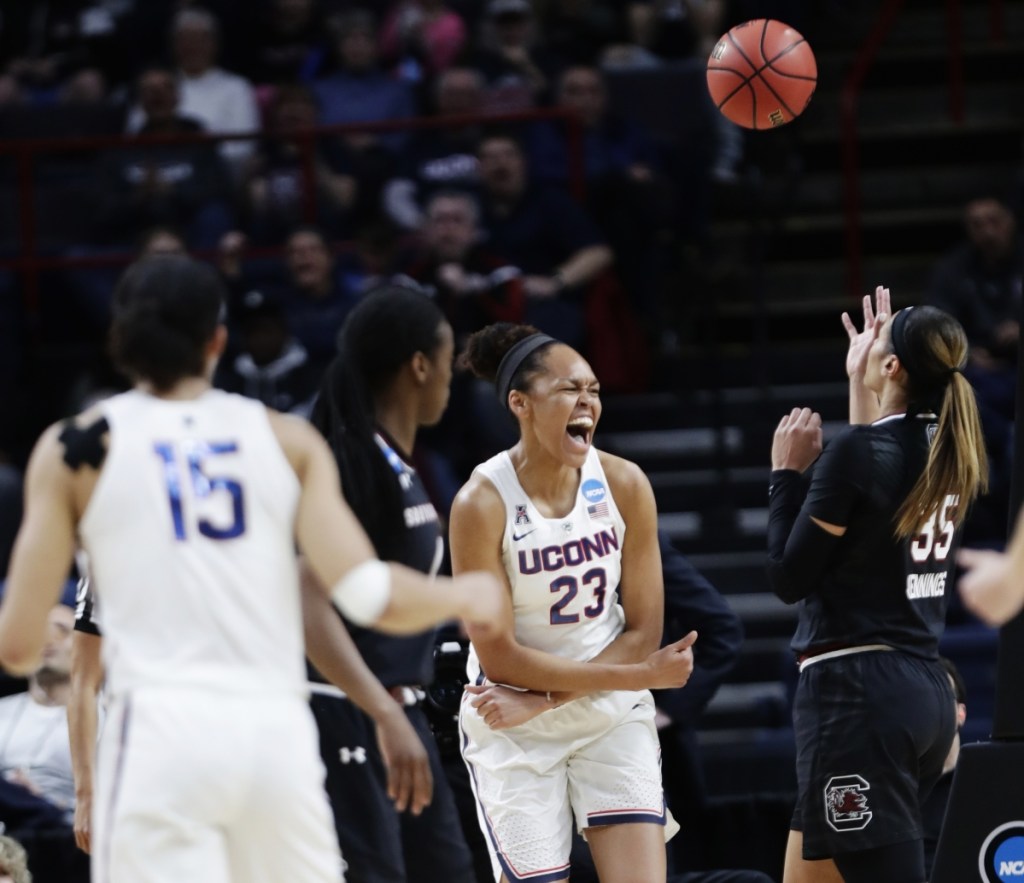 Connecticut's Azura Stevens celebrates after scoring in the first half of the Huskies' 94-65 win over South Carolina in the Albany Regional final Monday in Albany, New York.