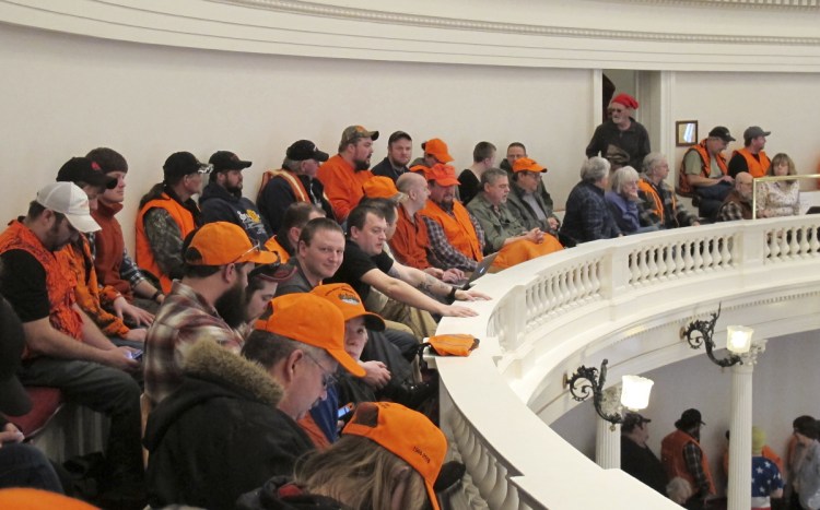 Gun control opponents wearing hunter orange pack the gallery in the Vermont House of Representatives on Tuesday in Montpelier, Vt.
