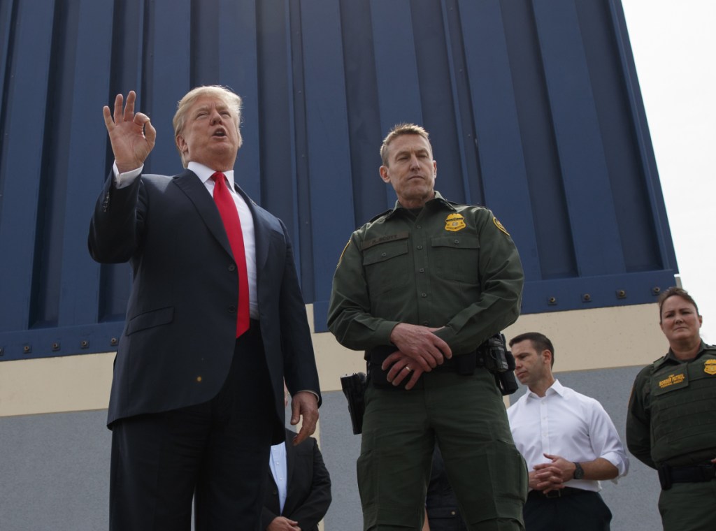President Trump reviews a border wall prototype in San Diego earlier this month. He suggested that the military could fund the long-promised wall in a tweet.