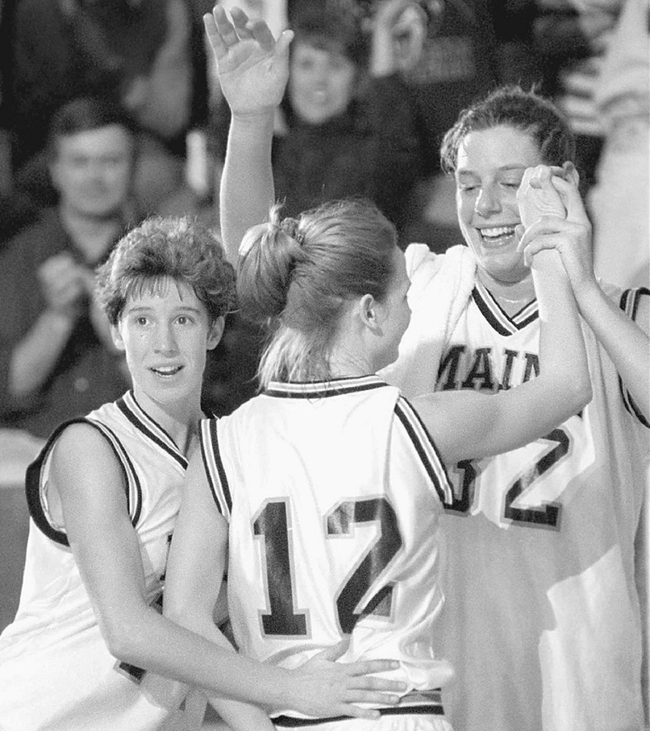 Stacey Porrini Clingan, right, was a top rebounder and shot blocker while helping Maine win the America East basketball title her final three seasons with the Black Bears, along with teammates Cindy Blodgett, left, and Kelly Stubbs, center.