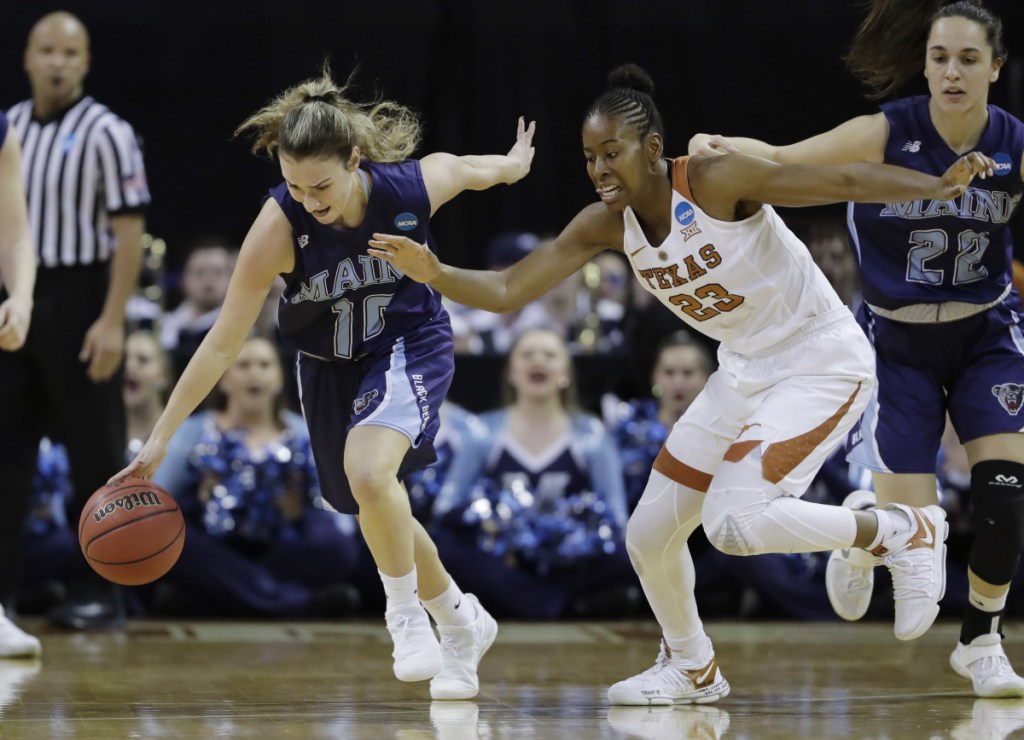 University of Maine guard Julie Brosseau moves the ball upcourt past Texas' Ariel Atkins during an NCAA tournament first-round game in Austin, Texas, on March 17. (AP Photo/Eric Gay)