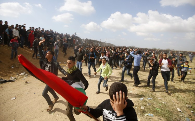 Palestinian protesters  along the Gaza Strip border with Israel, east of Khan Younis, Gaza Strip, on Friday.