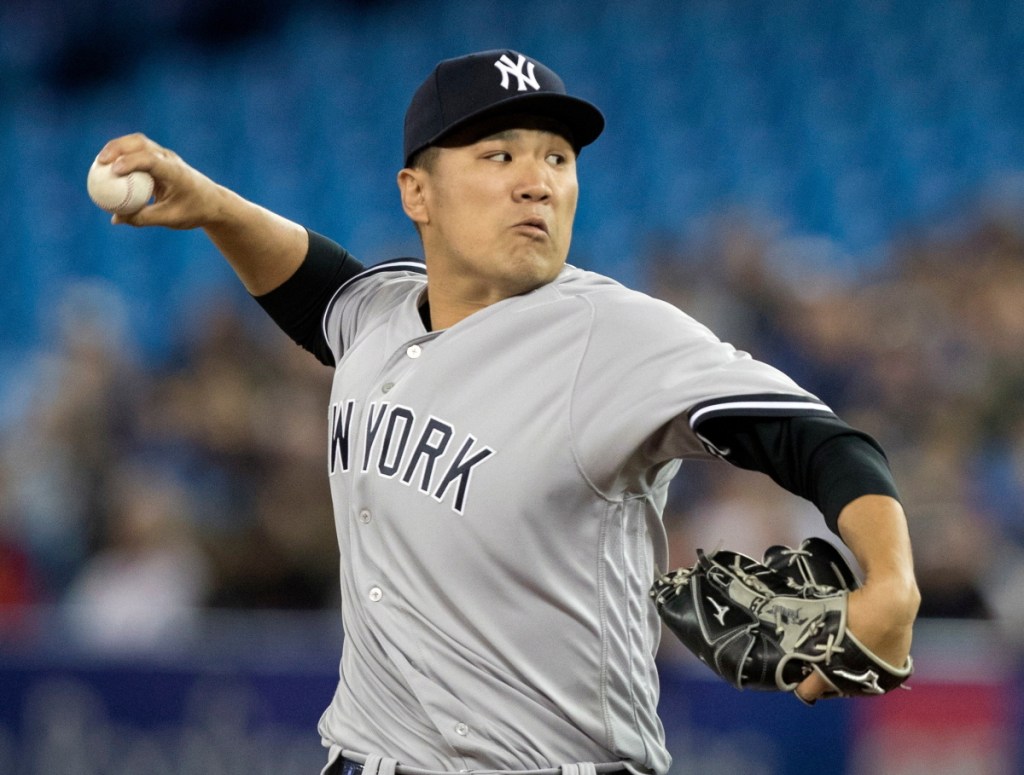 Masahiro Tanaka pitched six innings and the Yankees beat the Blue Jays 4-2 on Friday in Toronto.