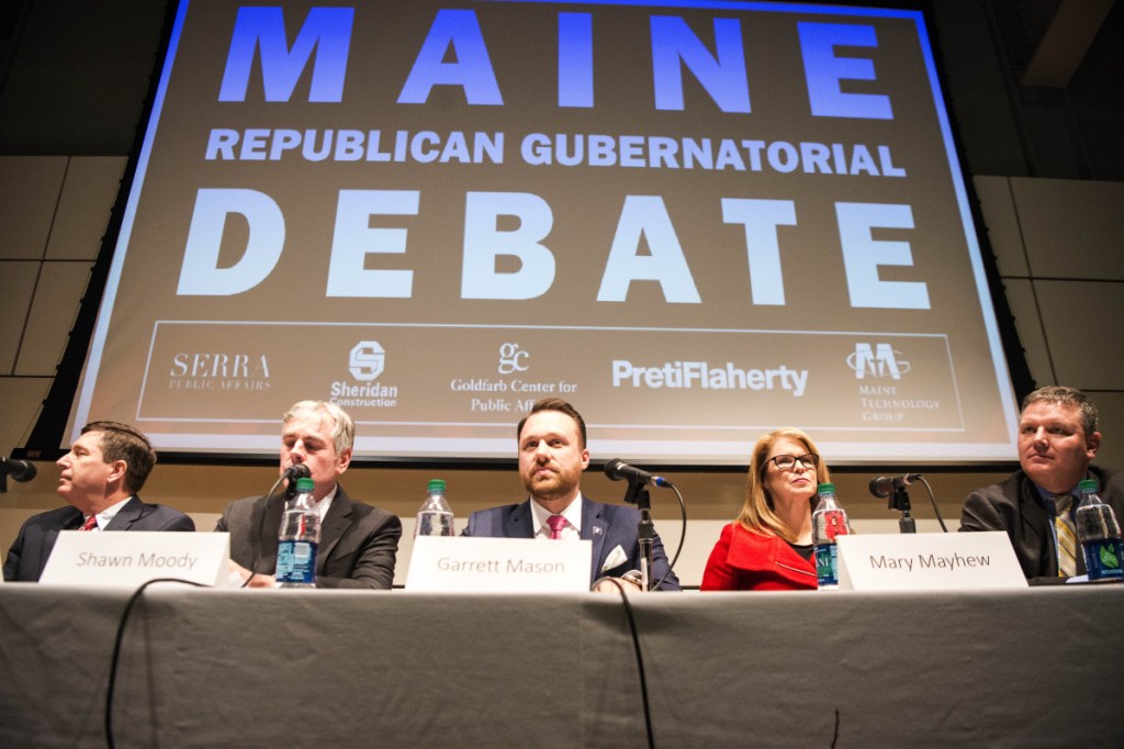 Republican candidates for governor, from left to right, Ken Fredette, Shawn Moody, Garrett Mason, Mary Mayhew, and Mike Thibodeau begin a debate at Ostrove Auditorium at the Diamond Building at Colby College in Waterville.