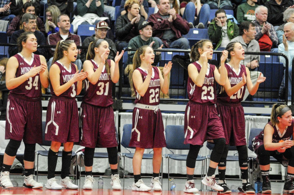 Members of the Monmouth Academy girls basketball team react during the Class C South title game last week at the Augusta Civic Center.