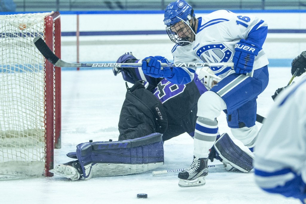 Colby College's John Rourke tries to score on Amherst College goalie Connor Girard earlier this season at Colby College in Waterville. Colby beat Amherst in the NESCAC quarterfinals last weekend to earn a trip to the league semifinals Saturday.