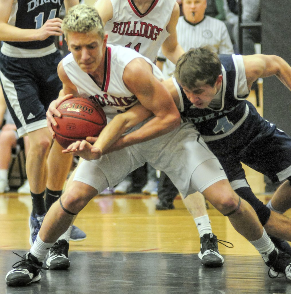 Hall-Dales' Jett Boyer, left, and Dirigo's Luke Lueders battle for a rebound during a game back on Feb. 1 in the Penny Memorial Gym in Farmingdale.