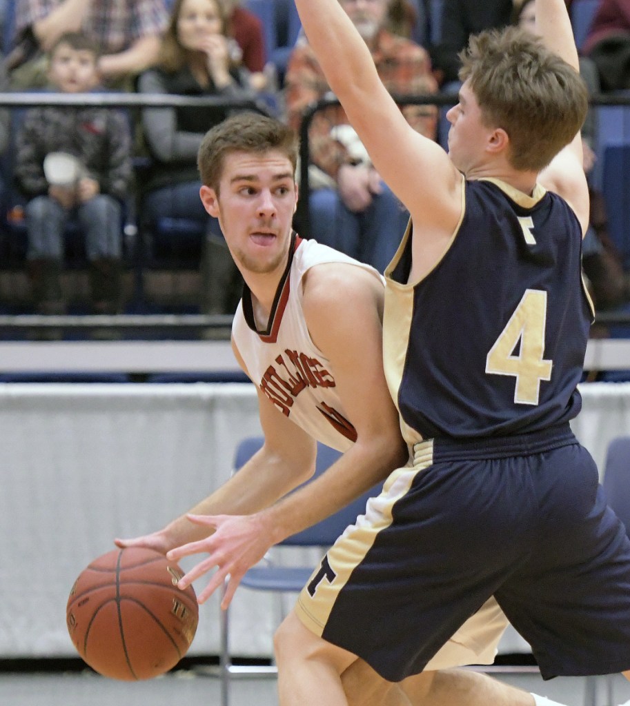 Hall-Dale's Alec Byron, left, looks for an opening as Traip's Charlie Driscoll defends during a Class C South quarterfinal game this month at the Augusta Civic Center. The Bulldogs play for the Class C championship this weekend.
