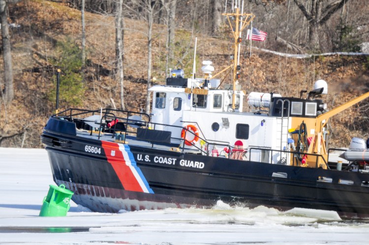 The USCGC Tackle breaks ice Thursday as it heads north on the Kennebec River between Pittston and Gardiner.