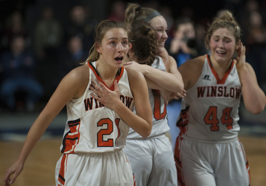 Winslow's Haley Ward looks to the scoreboard in the Cross Insurance Center in Bangor after the Black Raiders defeated Lake Region 43-29 in the Class B state championship game Friday night.