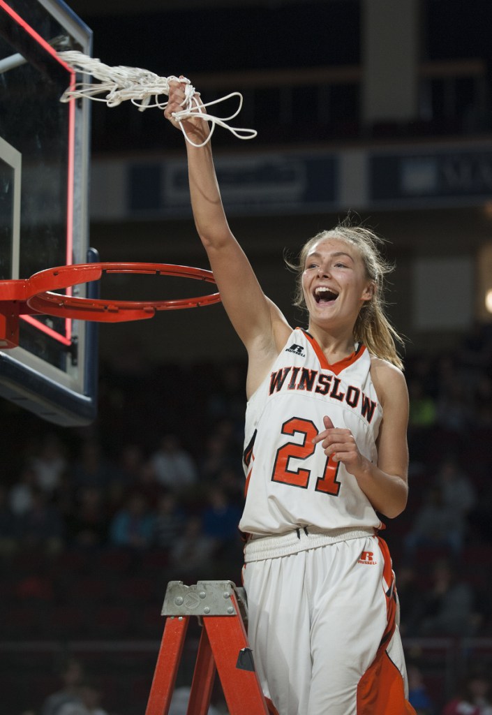 Winslow's Haley Ward swings a net after the Black Raiders defeated Lake Region 43-29 in the Class B Girls state championship game Friday at the Cross Insurance Center in Bangor.