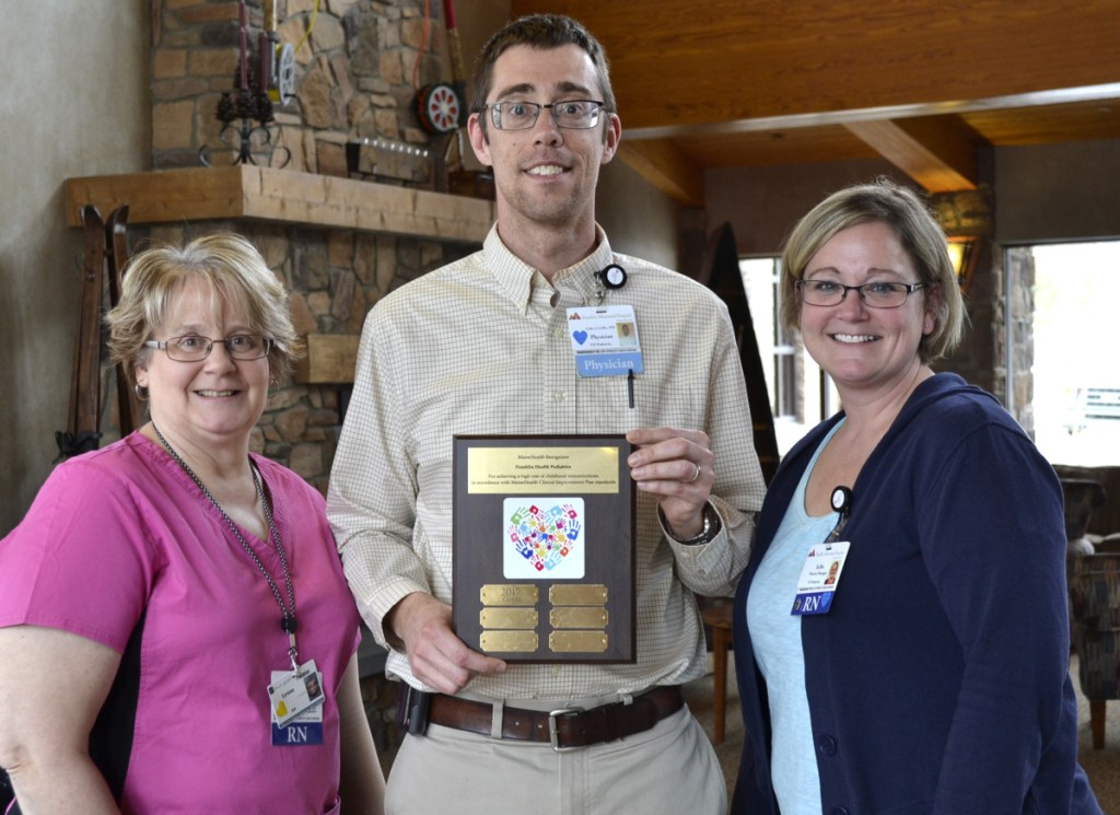 From left, resigtered nurse Lynne Pease, immunization coordinator; Dr. Gabriel Civiello, lead physician; and registered nurse Kellie Donahue, nurse manager, display the child immunization plaque awarded recently to Franklin Health Pediatrics.