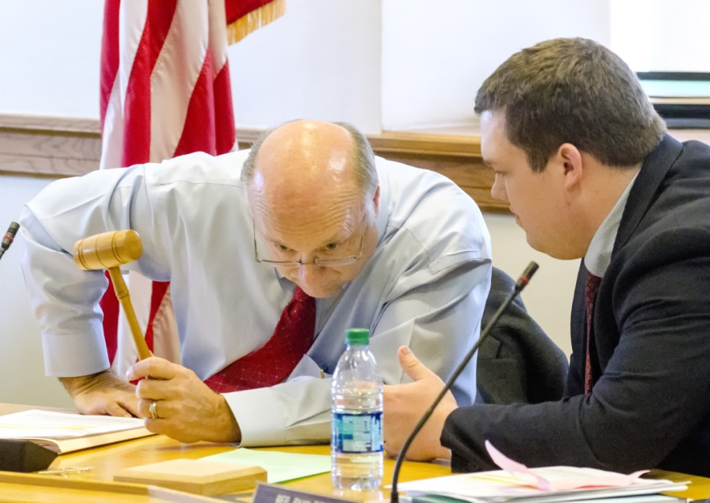Taxation committee co-chairs Sen. Dana Dow, R-Waldoboro, left, and Rep. Ryan Tipping, D-Orono, confer before start of a  work session on L.D. 1781 on Tuesday at the State House in Augusta.