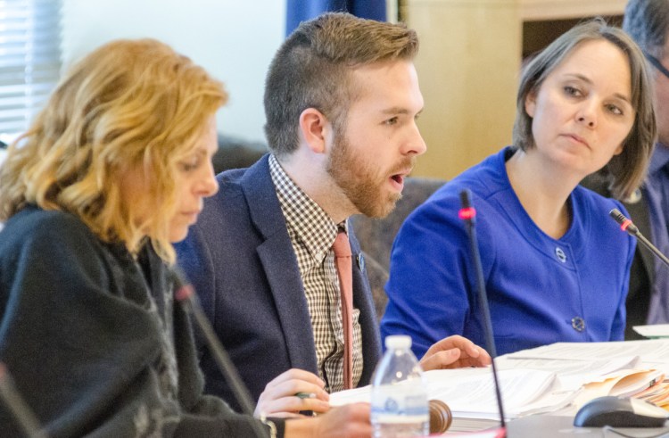 Sen. Amy Volk, R-Scarborough, left, and Rep. Ryan M. Fecteau, D-Biddeford, co-leaders of the Joint Standing Committee on Labor, Commerce, Research and Economic Development, and panel member Sen. Shenna Bellows, D-Manchester, participate in a work session on Tuesday, March 7, in the Cross State Office Building in Augusta.