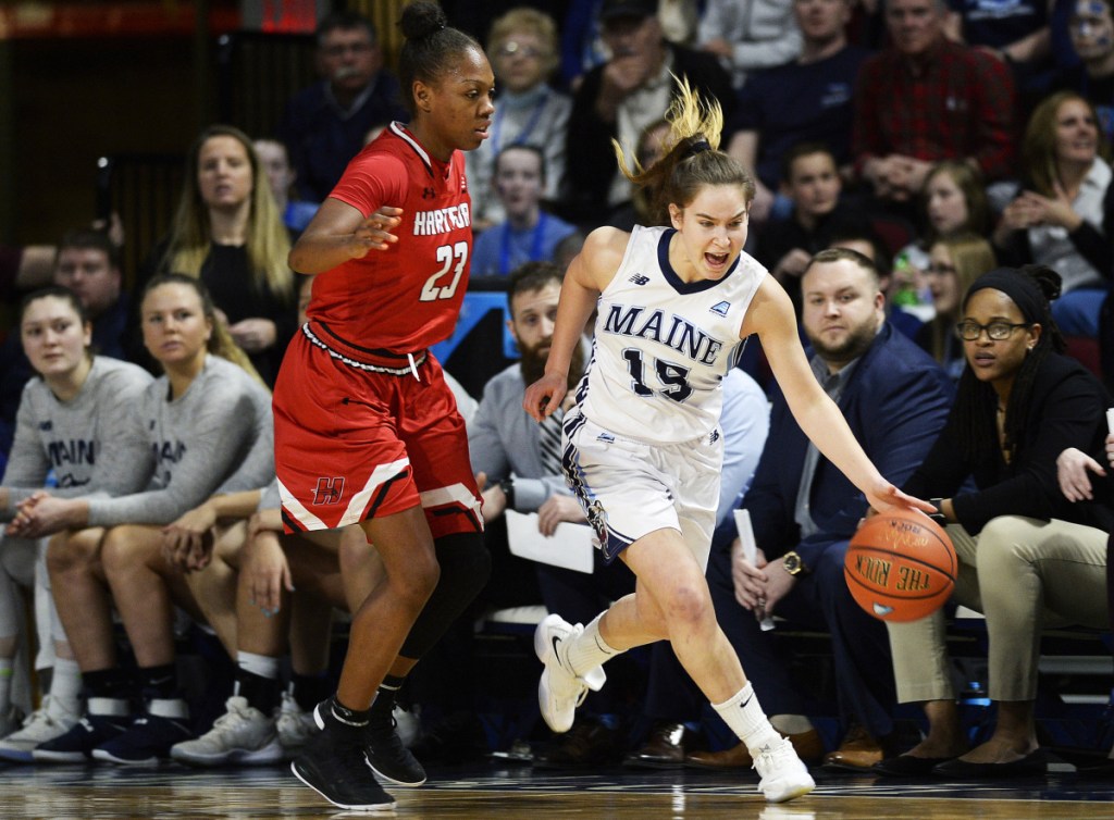 Maine's Dor Saar drives past Alexia Douglas of Hartford on Friday during the America East championship game in Bangor.