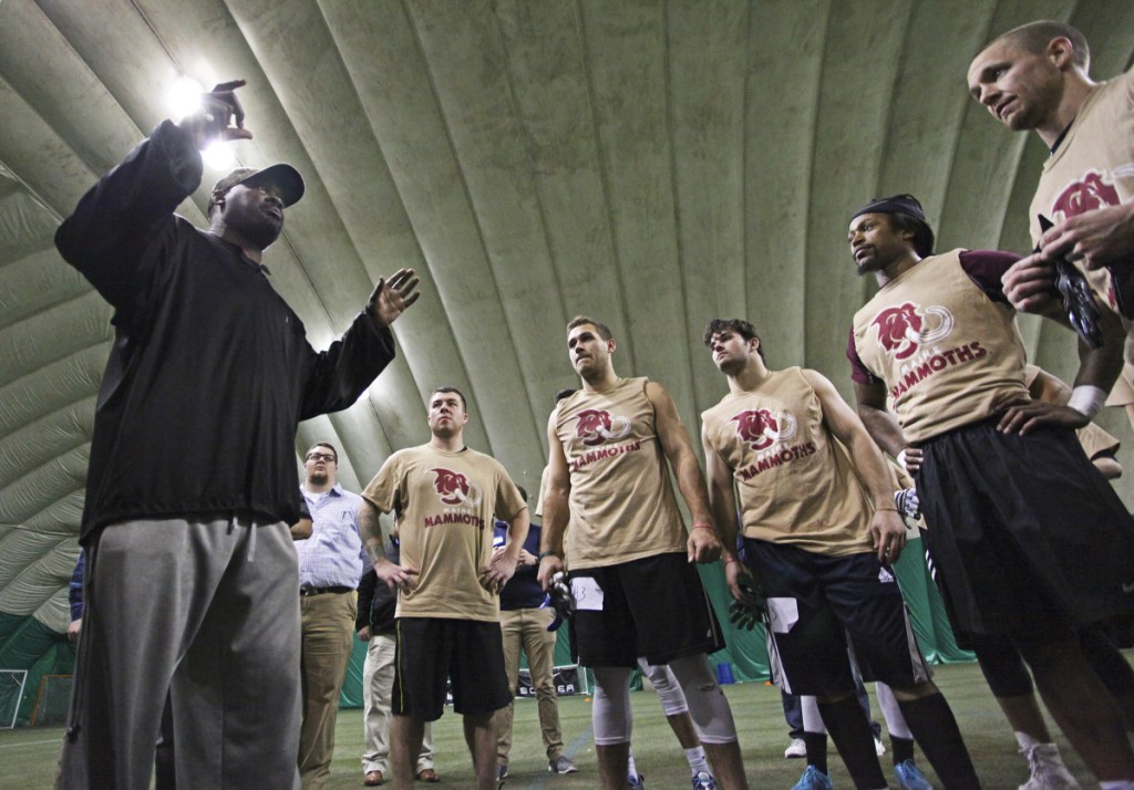 Head coach James Fuller speaks to players at the conclusion of local tryouts Sunday for Maine's new indoor football team, the Mammoths, at Seacoast United of Topsham.