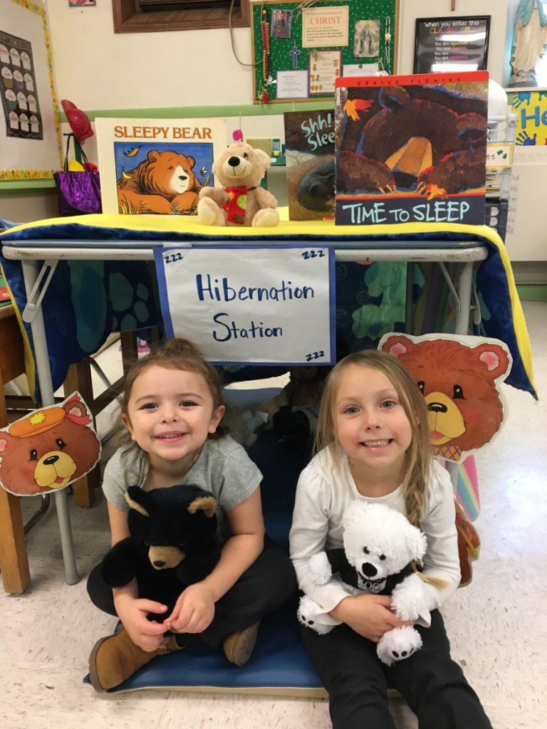 St. Dom's pre-kindergarten students recently studied hibernation and migration in their science units. Juliana Ramsey, left, and Norah Reeder take their turn in the hibernation station.