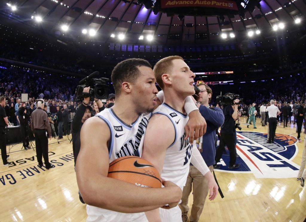 Villanova's Jalen Brunson, left, celebrates with Donte DiVincenzo after the team's game against Providence in the Big East men's tournament final Saturday in New York.