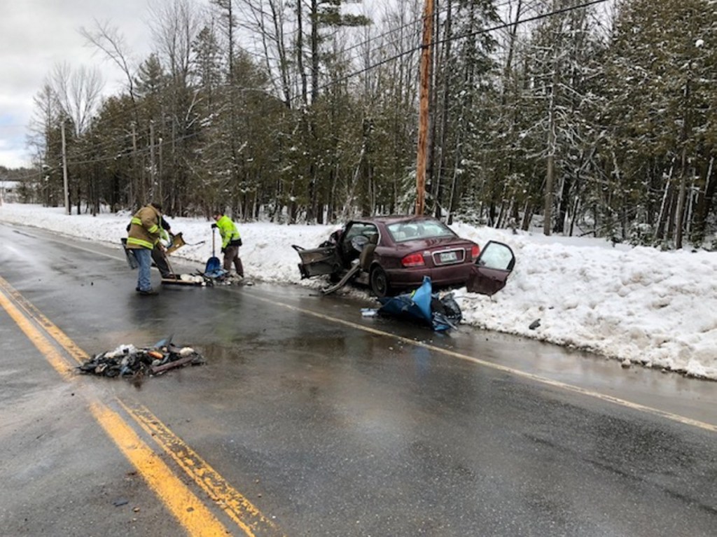 Debris from a two-car head-on collision on U.S. Route 2 in Canaan near the intersection with Tropical Fish Road is cleaned up. The two drivers and a passenger were all taken to hospitals to be treated for injuries that apparently were not life-threatening.