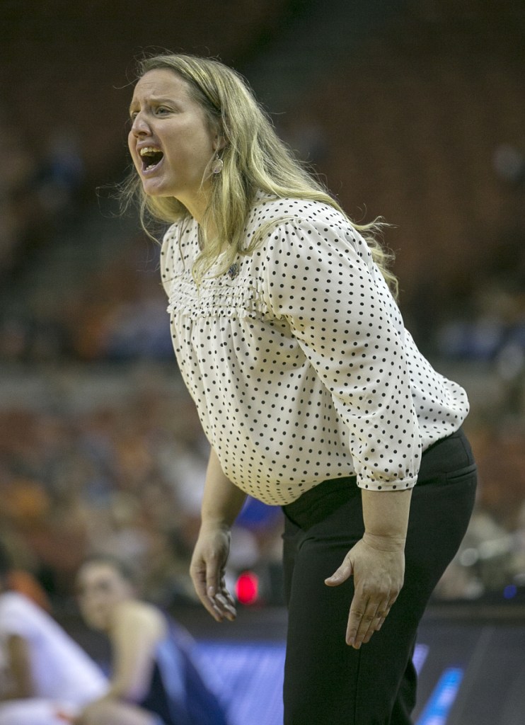 Maine women's basketball coach Amy Vachon yells to her team during the first quarter of an NCAA first round game Saturday night against Texas in Austin, Texas.