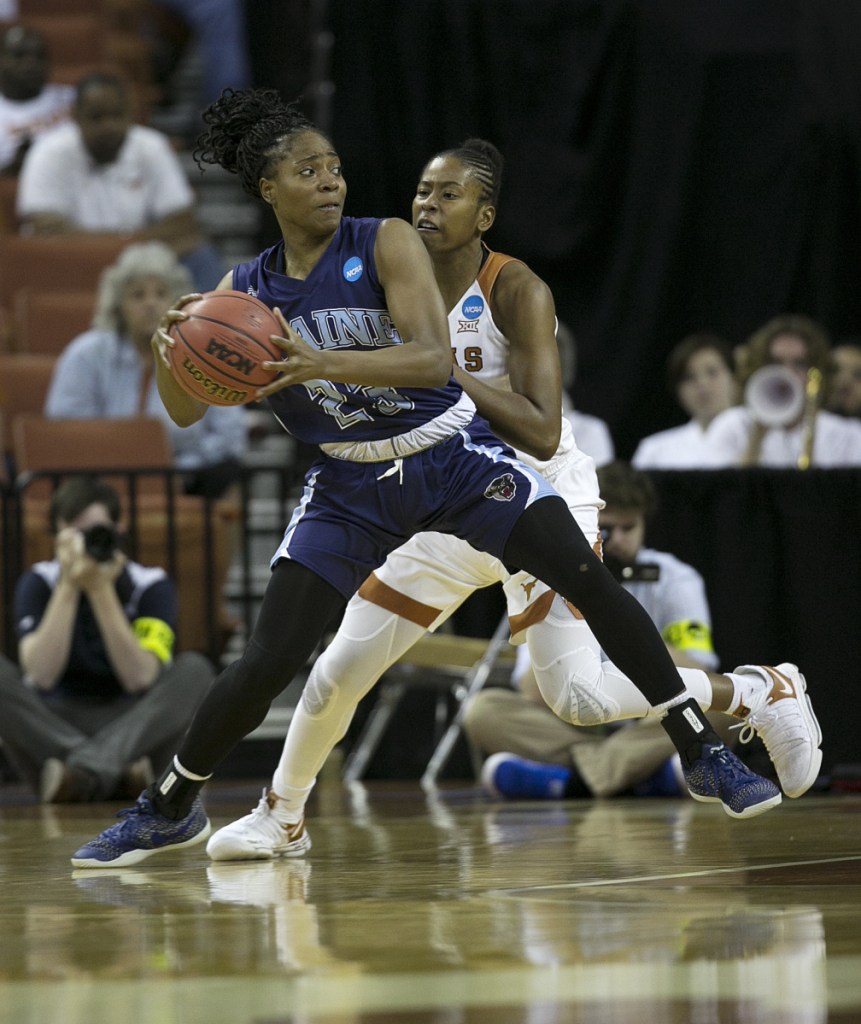 Texas defender Ariel Atkins pressures Maine guard Tanesha Sutton during the first quarter of an NCAA first round game Saturday night in Austin, Texas.