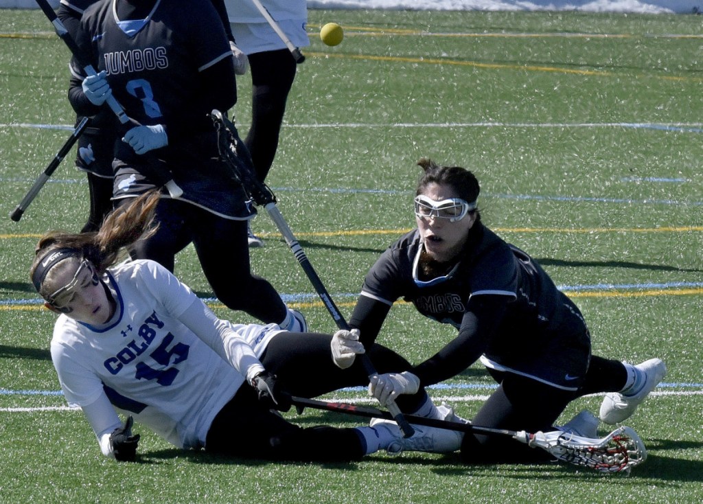Colby's Melinda Edie, left, and Tufts' Margaret Chase fall after colliding during a game Sunday in Waterville.