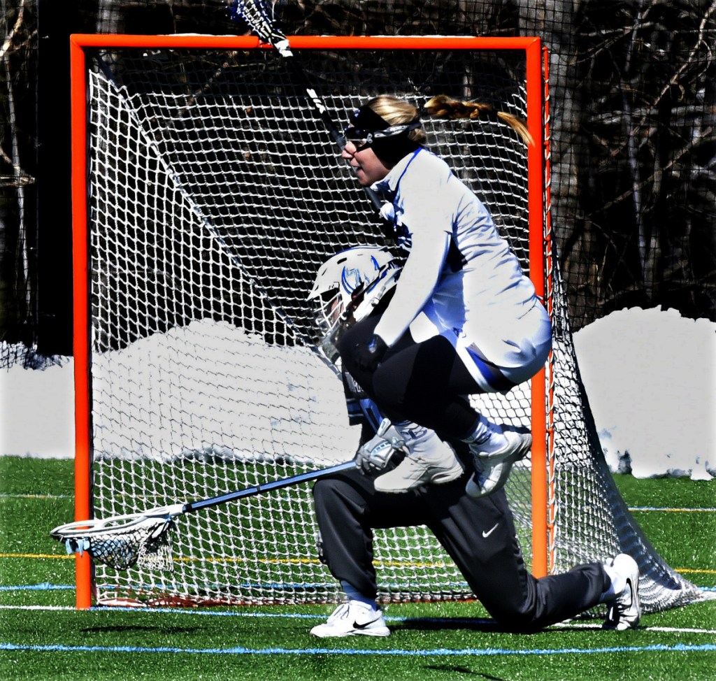 Colby's Sasha Fritts jumps with joy after scoring against Tufts on Sunday in Waterville.