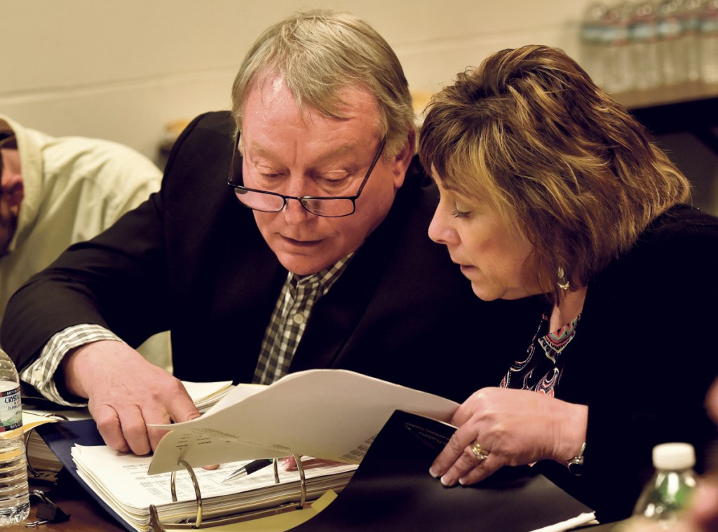 AOS 92 Superintendent Eric Haley, left, confers over budget figures with finance director Paula Pooler during a meeting Monday with the Winslow Town Council.