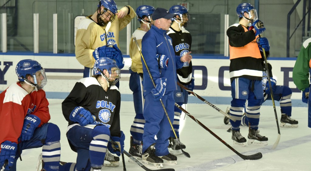 Colby College assistant hockey coach Mike Latendresse watches a drill during practice Tuesday in Waterville.