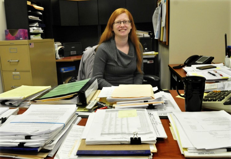 Skowhegan Town Manager Christine Almand, seen at her desk in the municipal building on Dec. 22, 2015, can't recall a time when no incumbents were running for re-election to a selectman's seat.