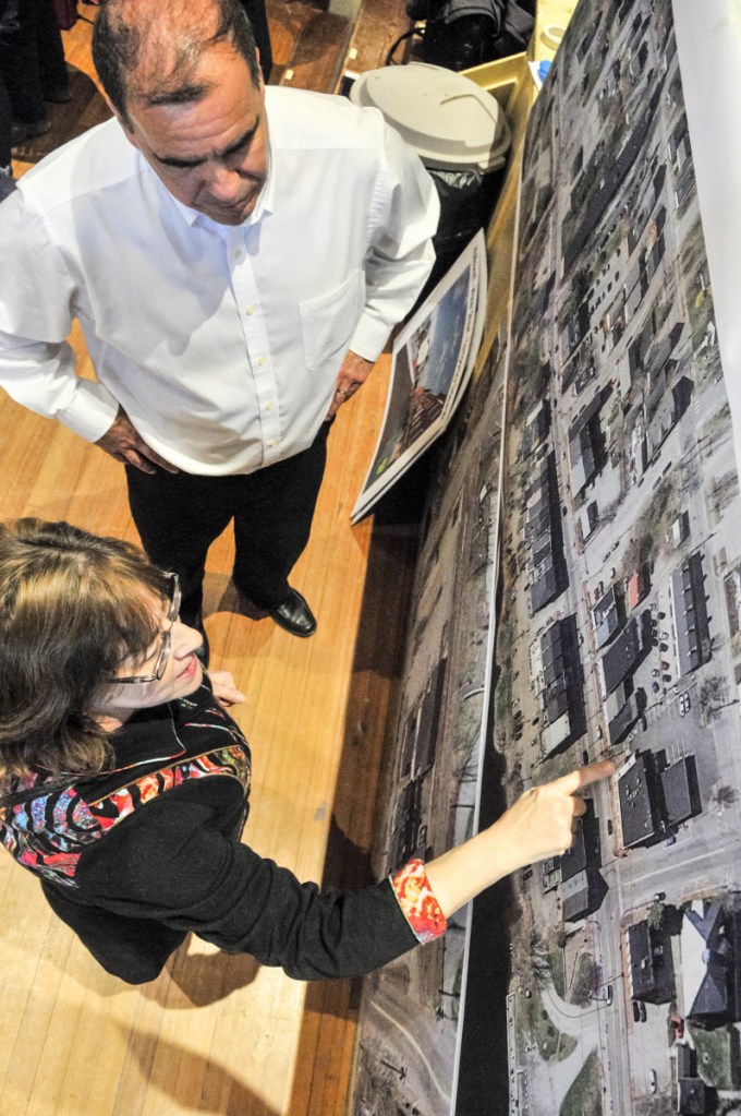 Ernie Martin, project manager for the Maine Department of Transportation, top, and Jean Irish discuss the upcoming Water Street construction project during an open house Thursday in Hallowell City Hall.