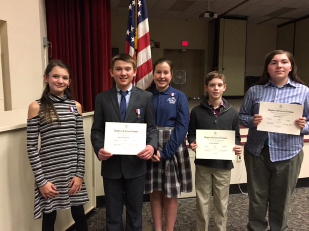 The DAR American History Essay contest winners, from left, are Ava Nadeau, Parker Reynolds and Georgiana Davidson, who placed first in their grade; and Teddy Wagner and Ethan Barrett, who placed second in their grade. Kameron Douin, who also placed second in his grade, was absent.
