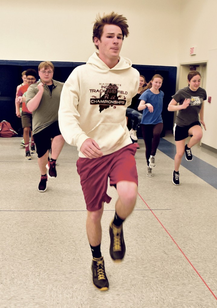 Erskine track and track runner Chris Weymouth does exercises with the team Monday in South China. It was the first day of spring practices.