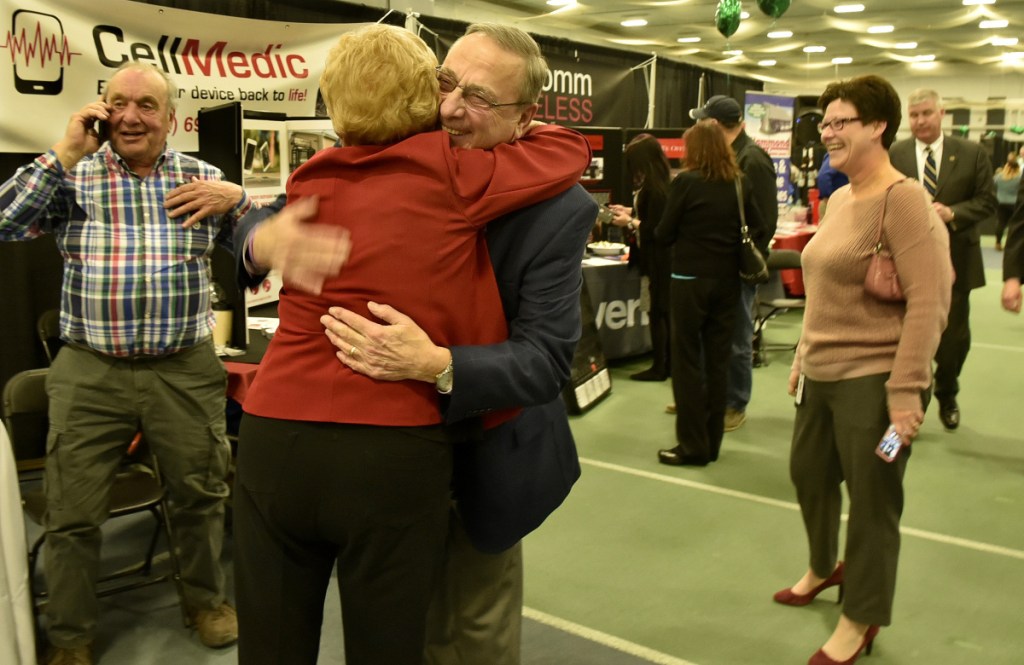 Gov. Paul LePage, no stranger to the Waterville area, hugs friend and businesswoman Lucille Zelenkewich, of People's United Bank, on Thursday during the Business to Business event at Colby College in Waterville.