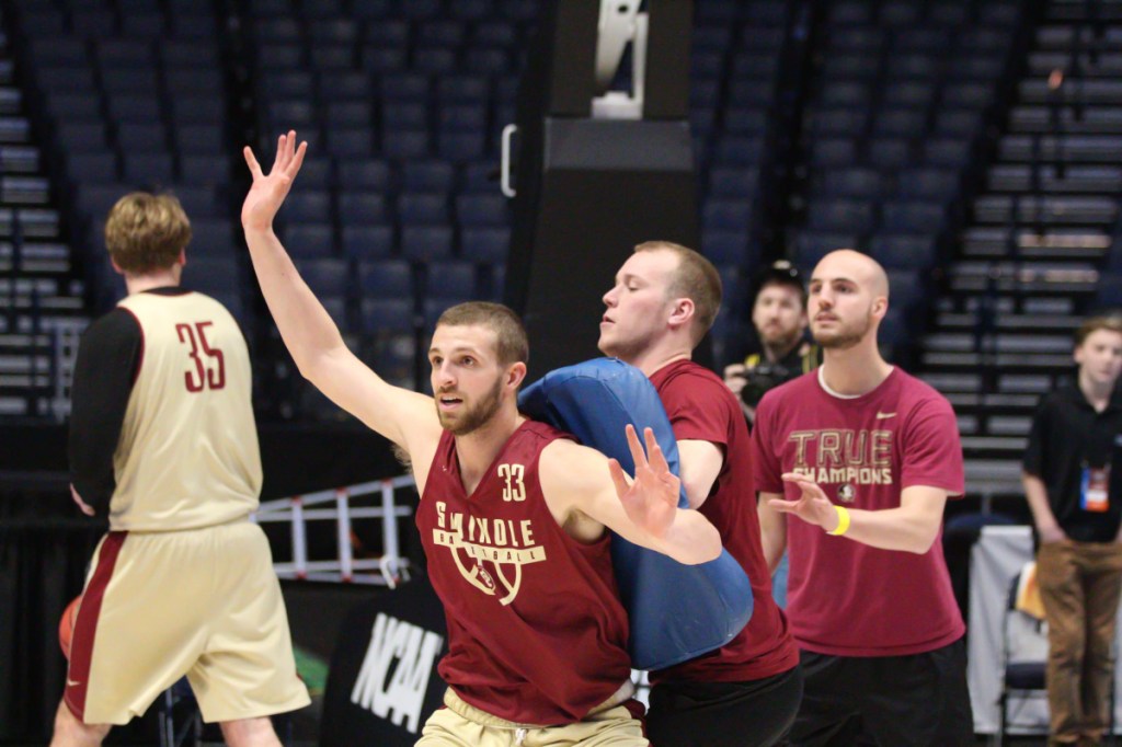 Keith Chesley, a Clinton native and former University of Maine at Augusta player, works with players during a recent Florida State men's basketball practice.