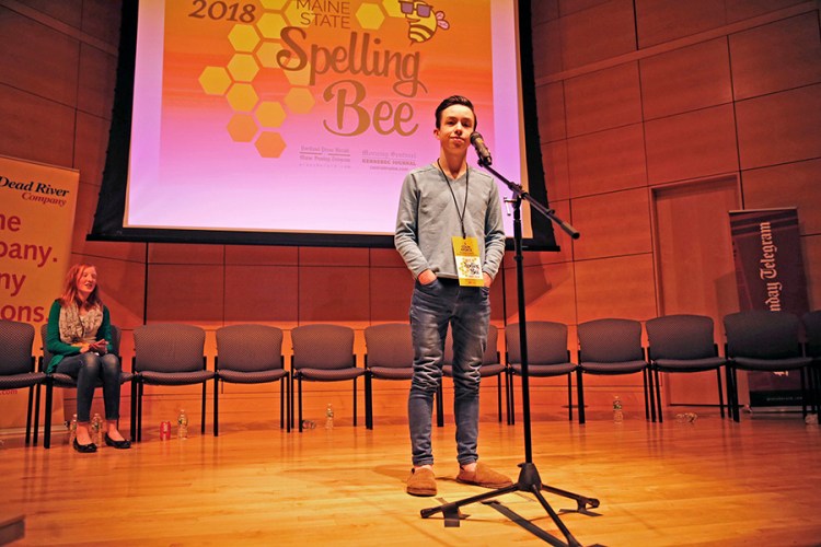 Colin Aponte, an eighth-grader at Downeast Homeschool Coop, reacts after successfully spelling "crescendo" to win the 2018 Maine State Spelling Bee on Saturday at University of Southern Maine. Second place finisher was Moriah Reusch, left, a seventh-grader from Mt. Blue Middle School.